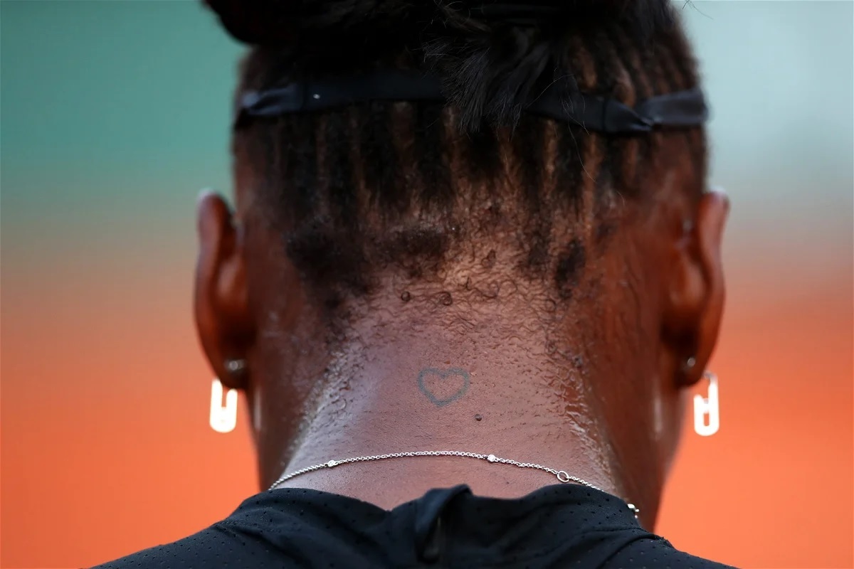 A tatoo is pictured on the neck of Serena Williams of The United States during the ladies singles second round match against Ashleigh Barty of Australia during day five of the 2018 French Open at Roland Garros